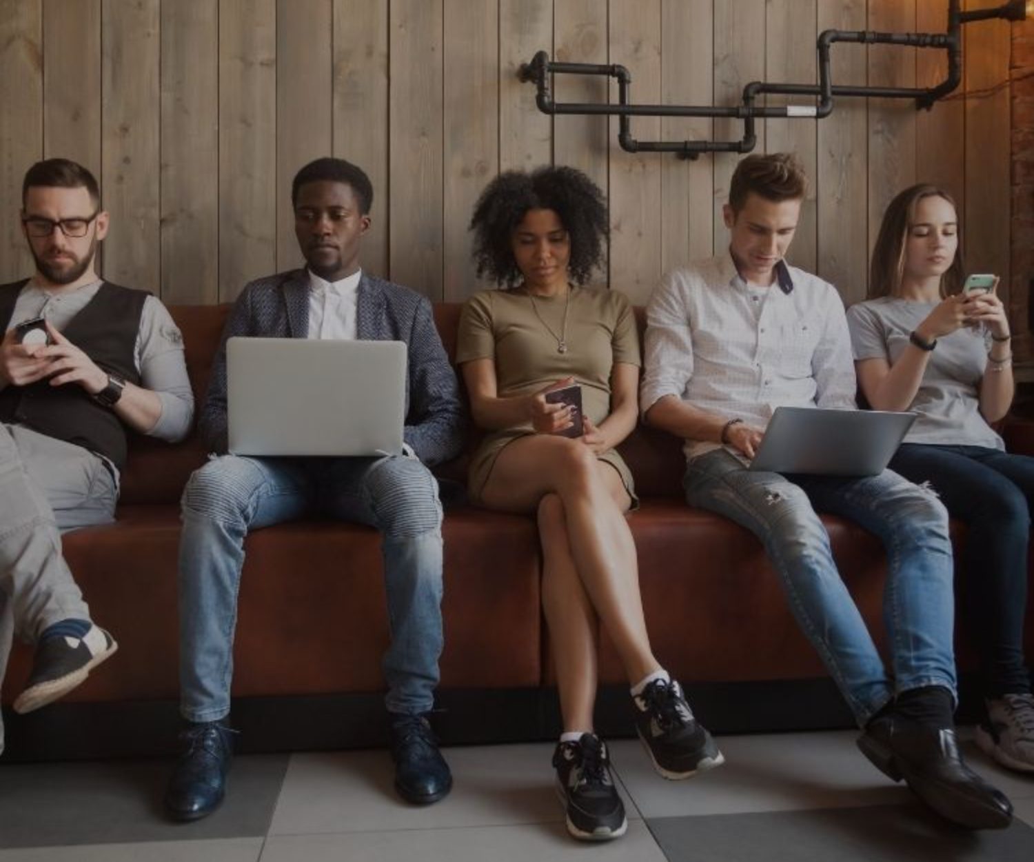 Millennials working with laptops and mobiles